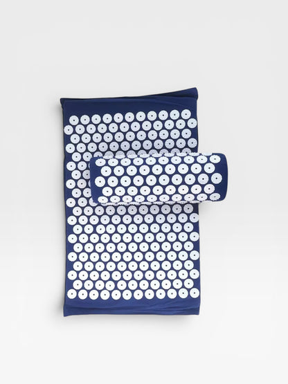 Essential Selects navy blue acupressure mat and pillow set with white ABS plastic spikes for relaxation and relief