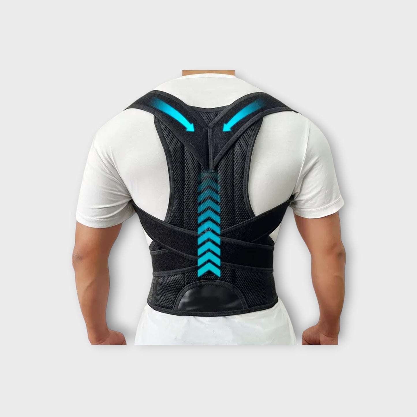 Essential Selects adjustable black mesh back posture corrector brace worn over a white t-shirt for spinal alignment.