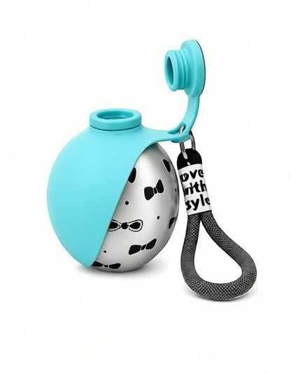 Essential Selects blue and silver stainless steel collapsible dog water bottle with a bow tie pattern and carry strap.