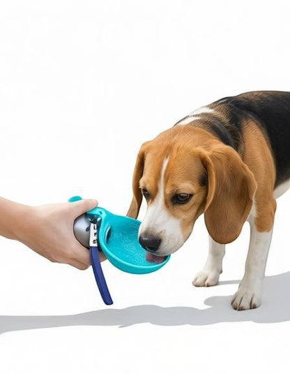 Essential Selects blue collapsible dog water bottle with a built-in silicone bowl being used by a beagle