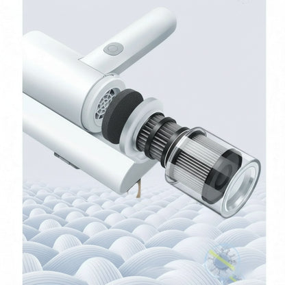 Essential Selects cordless mattress vacuum showing the removable HEPA filter and dust bin assembly for easy cleaning.
