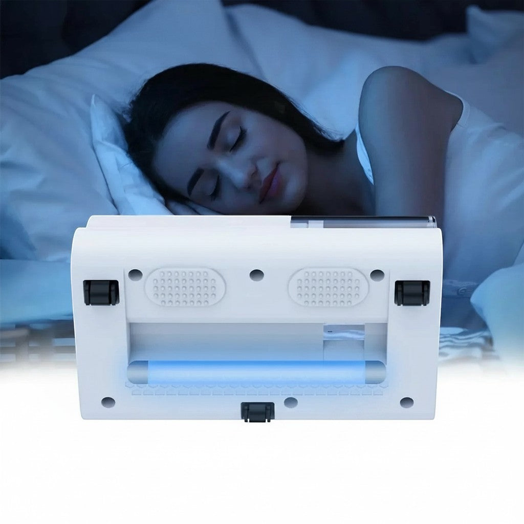 Essential Selects cordless mattress vacuum with UV light cleaning a bed while a woman sleeps in the background