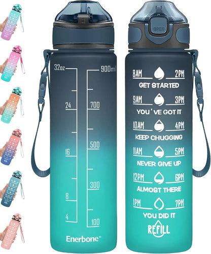 Essential Selects Enerbone 32oz motivational water bottle in green-purple gradient with time markers and carry strap.