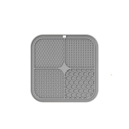 Essential Selects gray silicone lick mat for dogs and cats with four textured surfaces for spreadable treats.