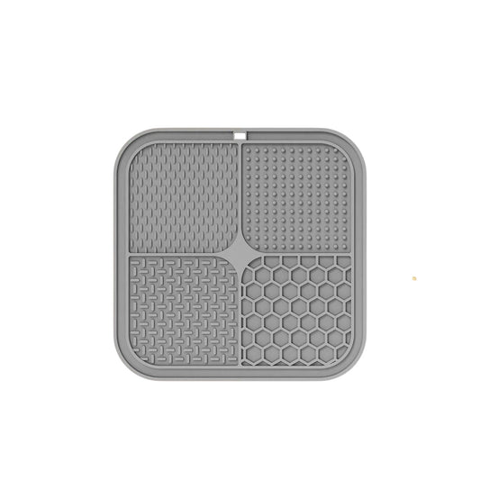 Essential Selects gray silicone lick mat for dogs and cats with four textured surfaces for spreadable treats.