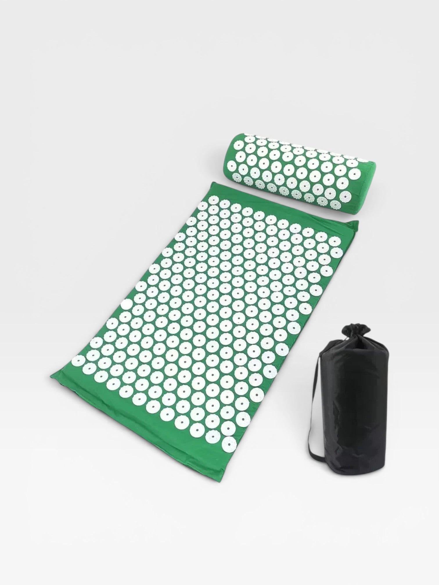 Essential Selects green acupressure mat and pillow set with white ABS plastic spikes and a black carrying bag.