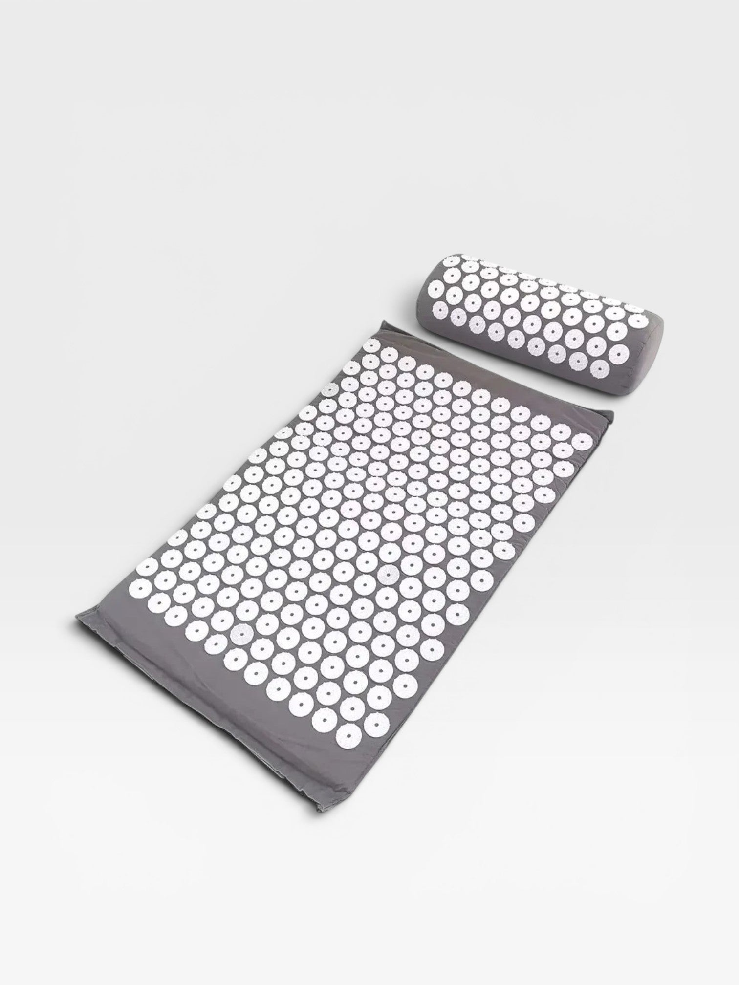 Essential Selects grey acupressure mat and pillow set with white ABS plastic spikes for relaxation and back relief