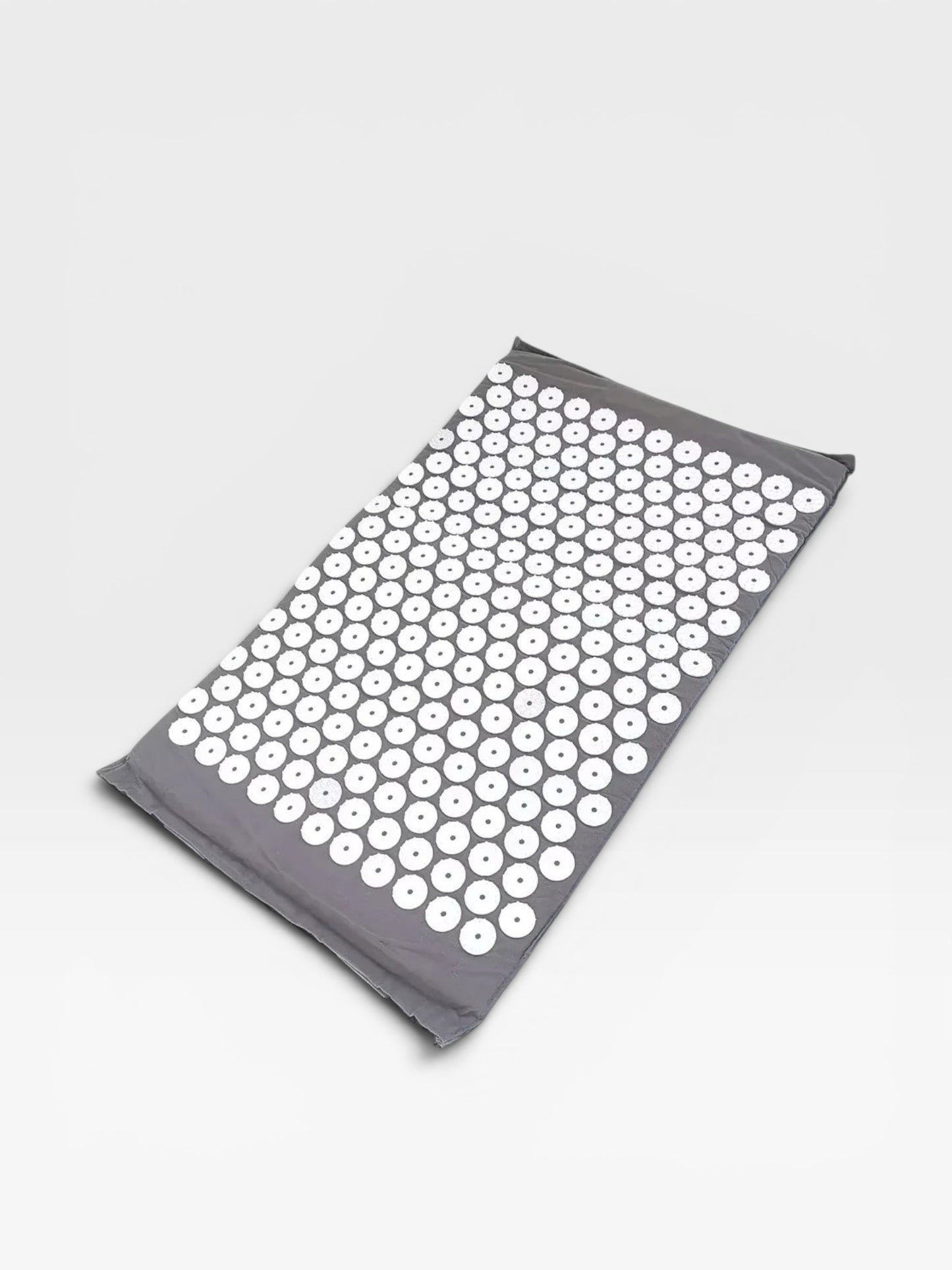 Essential Selects grey acupressure mat with white ABS plastic spikes for relaxation and back pain relief