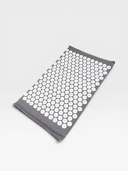 Essential Selects grey acupressure mat with white ABS plastic spikes for relaxation and back pain relief