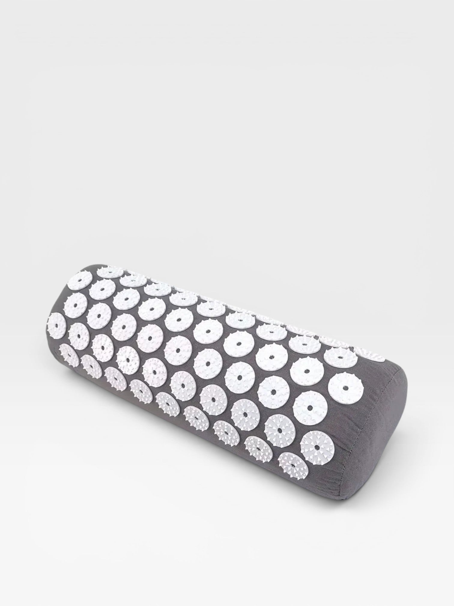 Essential Selects grey acupressure pillow with white ABS plastic spike discs for neck and back relaxation