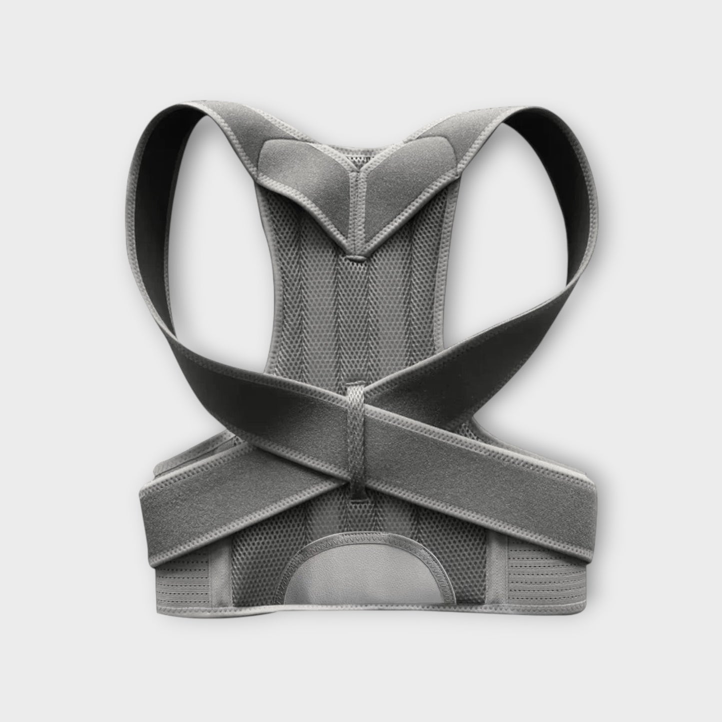 Essential Selects adjustable grey mesh back posture corrector brace with reinforced spinal support straps.