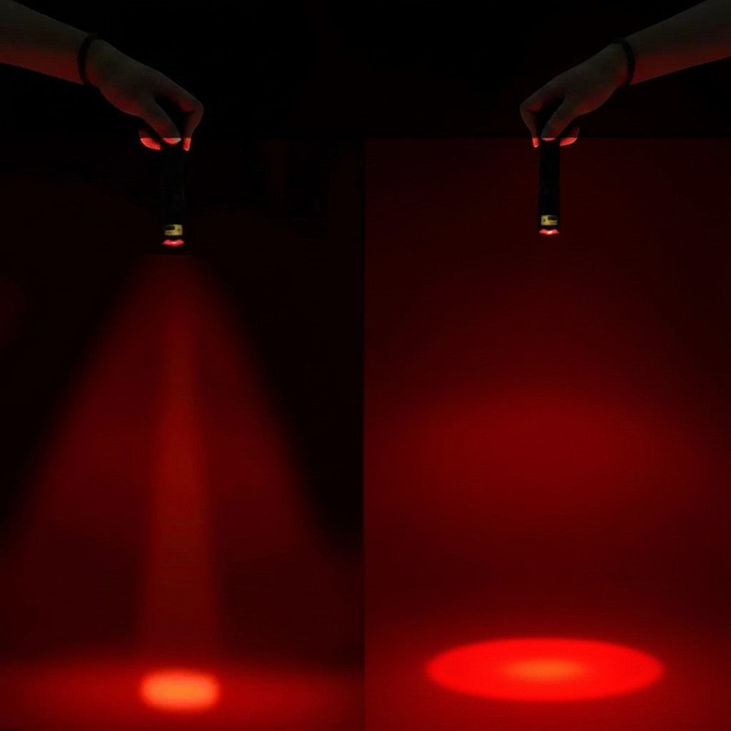 Essential Selects METII portable LED flashlight showing adjustable red light beam focus for night vision use
