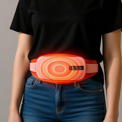 Essential Selects pink cordless menstrual heating pad and waist massager with glowing orange heat display on a person