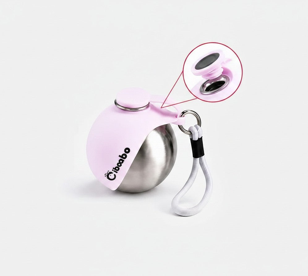 Essential Selects light pink stainless steel portable dog water bottle with a collapsible silicone bowl and carry rope