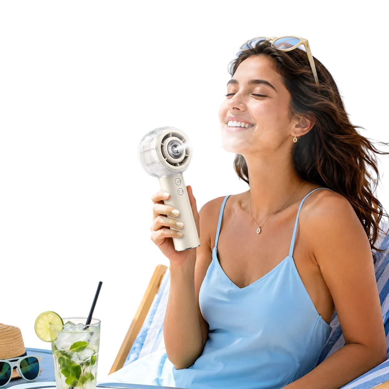 Essential Selects portable misting handheld fan held by a woman relaxing on a beach chair for instant cooling
