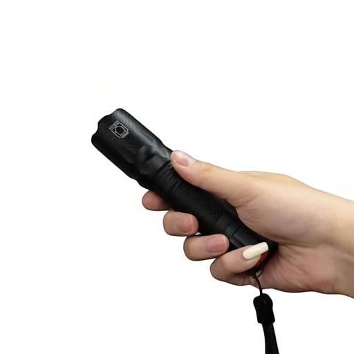 Essential Selects METII portable aluminum tactical flashlight with adjustable focus and wrist strap held in hand