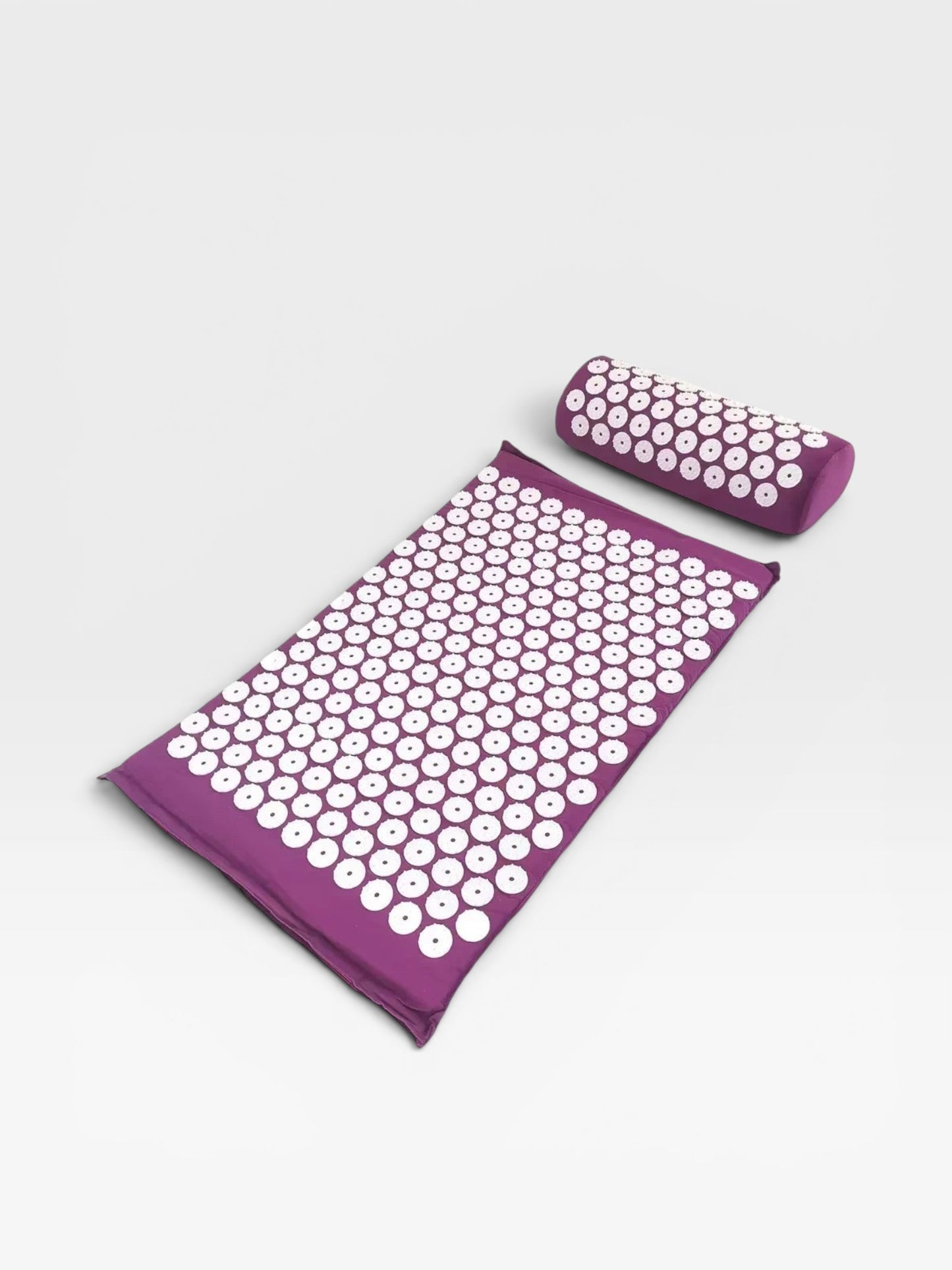 Essential Selects purple acupressure mat and pillow set with white ABS plastic spikes for relaxation and pain relief.