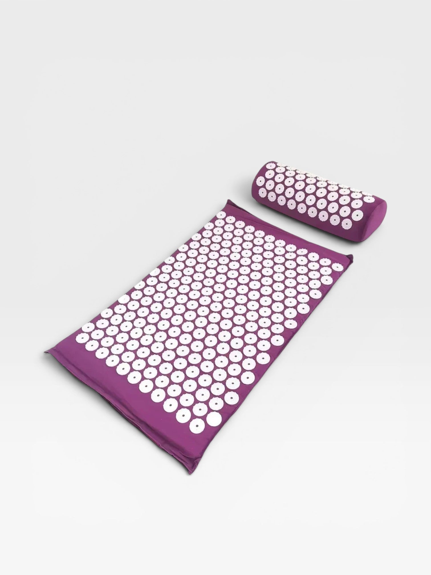 Essential Selects purple acupressure mat and pillow set with white ABS plastic spikes for relaxation and pain relief.
