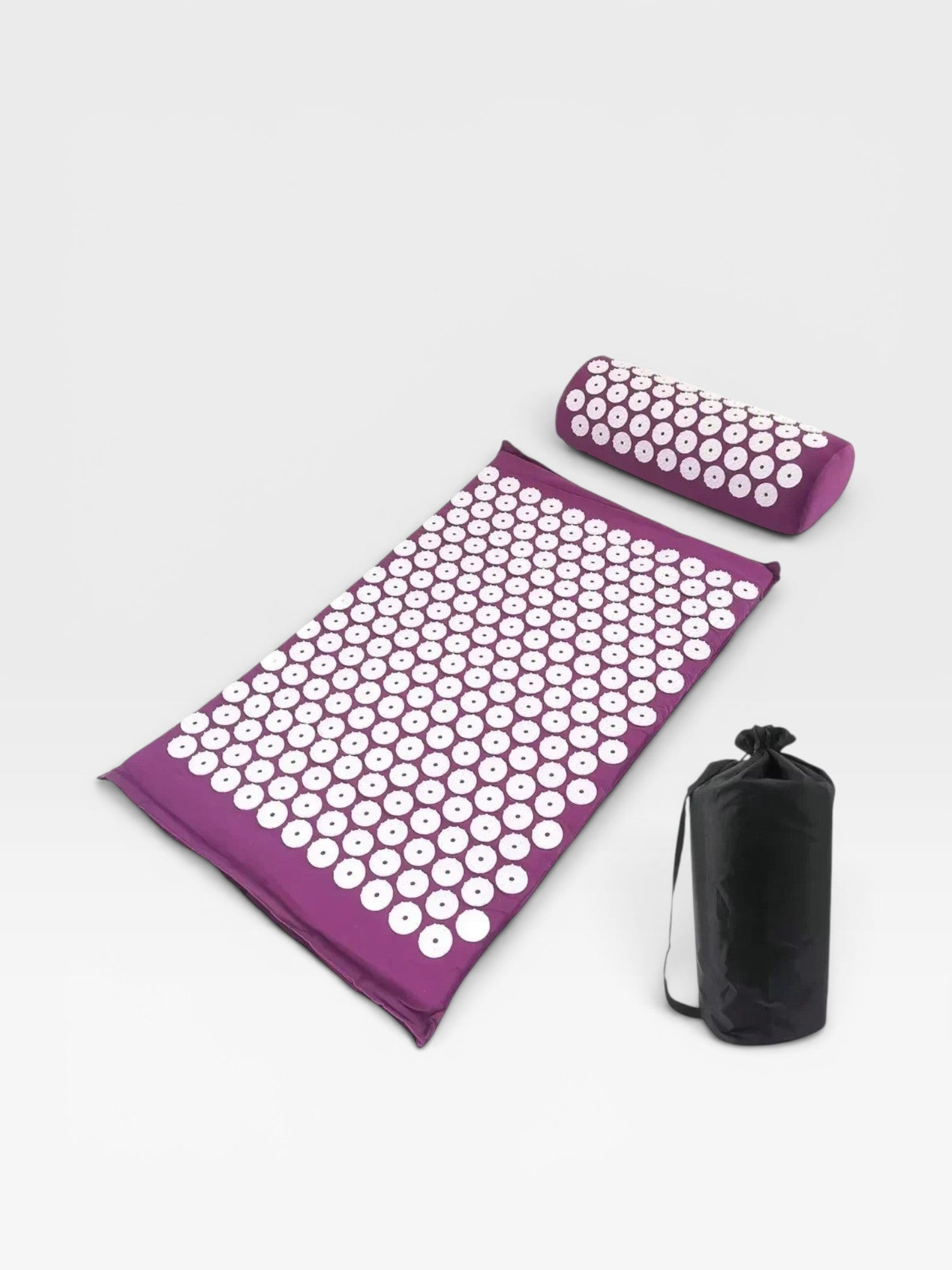 Essential Selects purple acupressure mat and pillow set with white ABS plastic spikes and a black carrying bag.