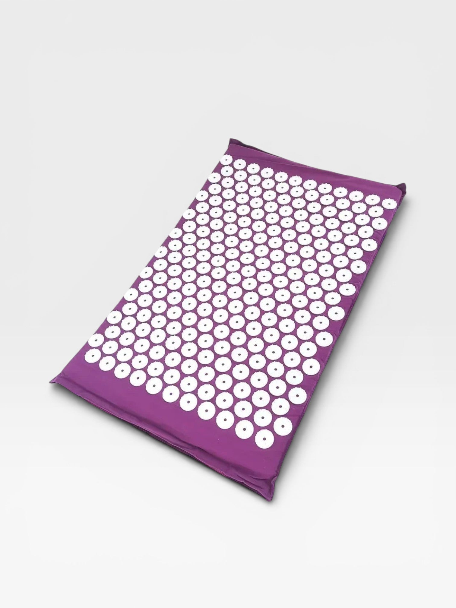 Essential Selects purple acupressure mat with white ABS plastic spikes for relaxation and back pain relief