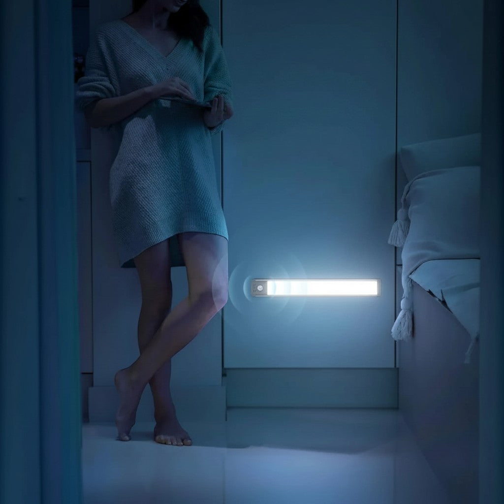 Essential Selects rechargeable motion sensor LED light mounted on a bedroom wall, providing bright white illumination.