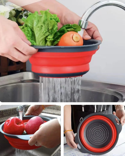 Essential Selects red silicone collapsible colanders being used to wash fresh vegetables and fruit in a kitchen sink