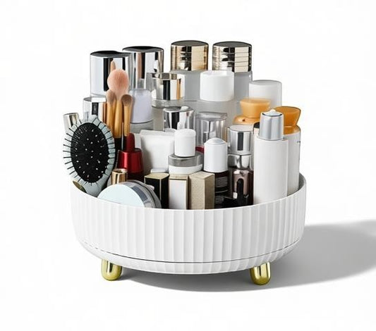 Essential Selects white rotating makeup organizer with gold feet, holding various skincare and cosmetic bottles.