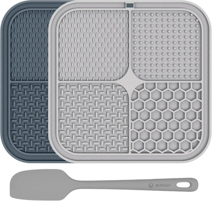 Essential Selects gray and beige silicone lick mats for dogs with four textured surfaces and a matching spatula