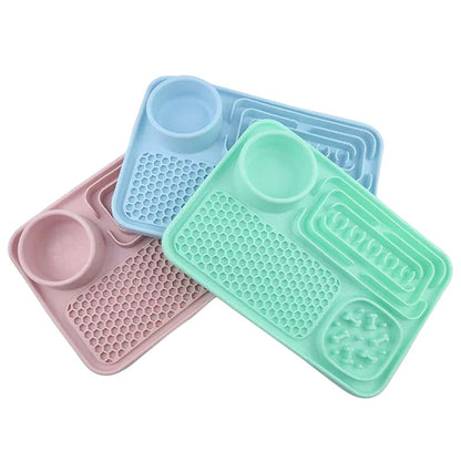 Essential Selects silicone slow feeder mats for dogs in pink, blue, and green with textured feeding patterns.