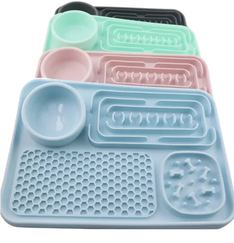 Essential Selects silicone slow feeder pet placemats in blue, pink, green, and grey for healthy dog feeding.