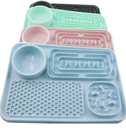 Essential Selects silicone slow feeder pet placemats in blue, pink, green, and grey for healthy dog feeding.