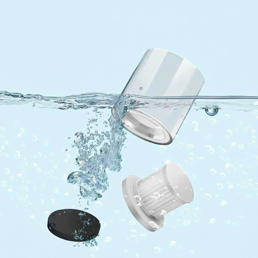 Essential Selects cordless mattress vacuum washable dust bin and HEPA filter components submerged in water for cleaning