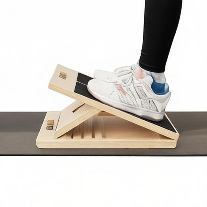 Essential Selects wooden slant board for calf stretching with adjustable incline and non-slip surface in use