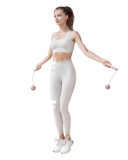 Essential Selects YOTTOY pink cordless jump rope with counter being used by a woman in athletic wear